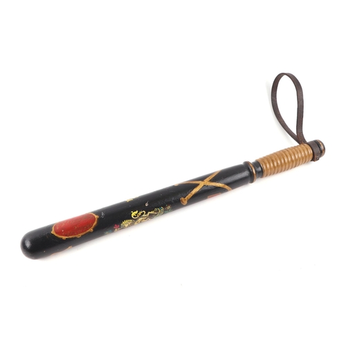 116 - A repainted Victorian Police truncheon 45cms (17.75ins) long on a wooden mount with brass plaque whi... 