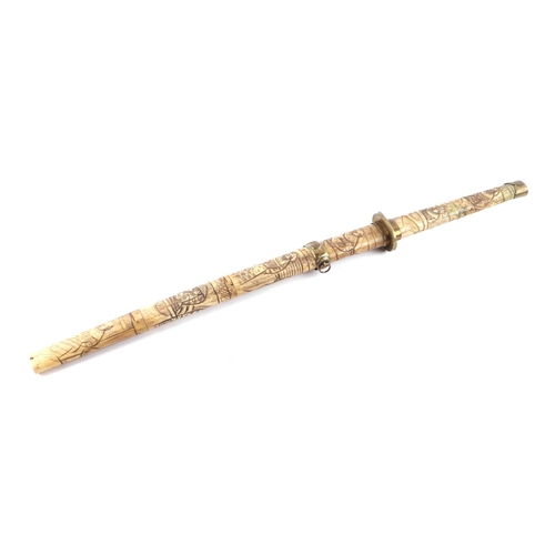 119 - A late 19th century Japanese carved bone short sword or Wakizashi, carved all over with figures. Bla... 
