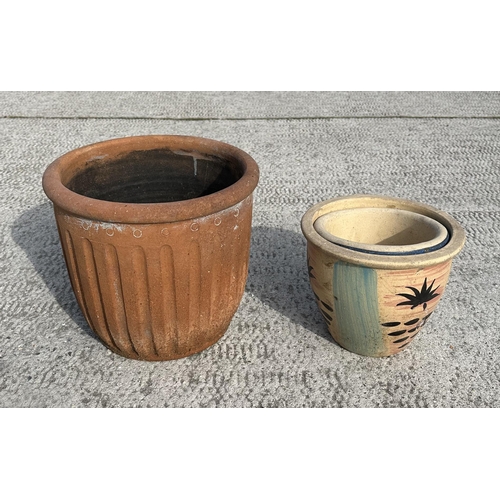 62 - A set of four well weathered reconstituted stone lobed form planters, 32cms wide; together with a te... 