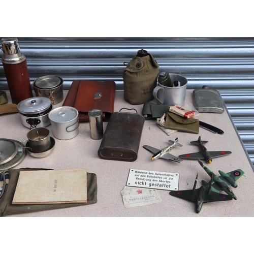 119 - A large quantity of militaria in a tin trunk named to 'M C Barrett' to include hip flasks, canvas ba... 