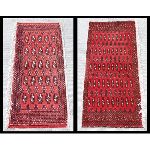 148 - Two small Persian Turkoman woollen hand-made rugs with geometric designs on a red ground, each appro... 