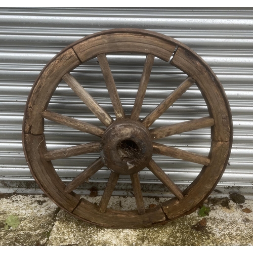 21 - An iron bound cart wheel.86 cm diameter