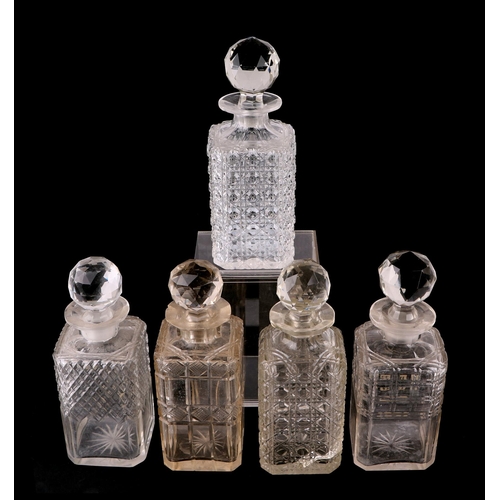 233 - A quantity of cut glass decanters to include a set of five liquor decanters.