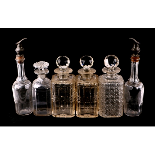 233 - A quantity of cut glass decanters to include a set of five liquor decanters.