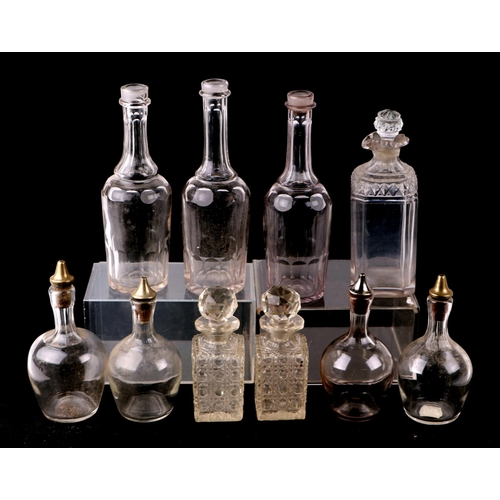 233 - A quantity of cut glass decanters to include a set of five liquor decanters.