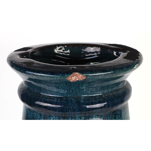 246 - A turquoise glazed pottery jardiniere stand or umbrella stand, 48cms high.