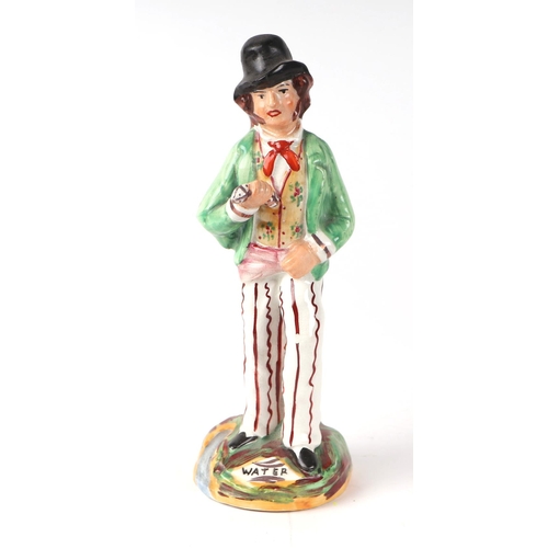 248 - A Staffordshire back-to-back figure depicting a gentleman drinking gin and water, 22cms high.