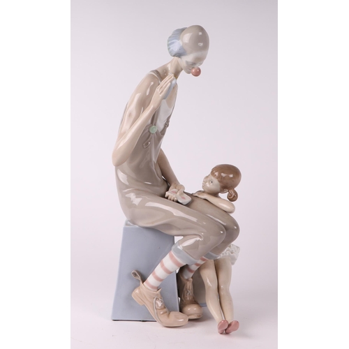 250 - A Lladro figural group depicting a clown and a ballerina, 41cms high.