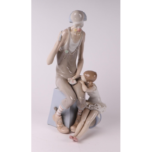 250 - A Lladro figural group depicting a clown and a ballerina, 41cms high.