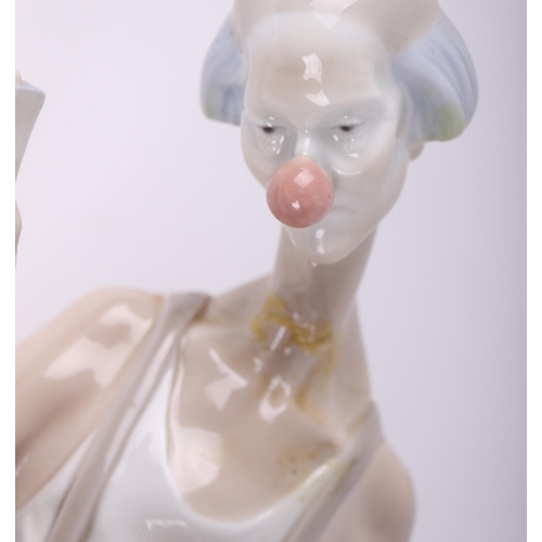 250 - A Lladro figural group depicting a clown and a ballerina, 41cms high.