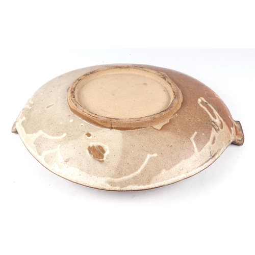 258 - A large Bernard Rooke style Studio pottery two-handled shallow dish, 57cms wide.