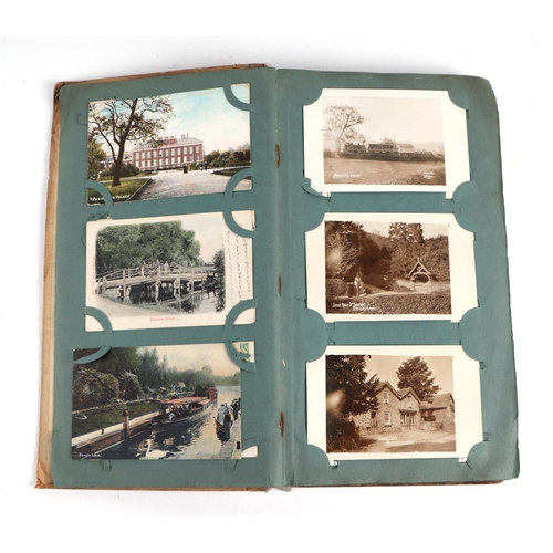 33 - An early 20th century complete postcard album to include topographical, whimsical, military, histori... 