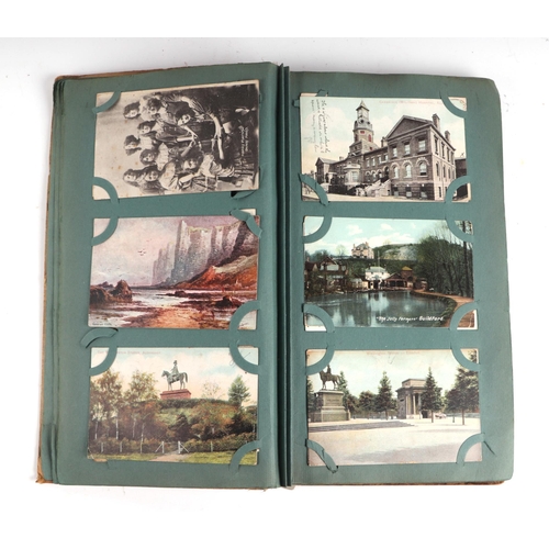 33 - An early 20th century complete postcard album to include topographical, whimsical, military, histori... 