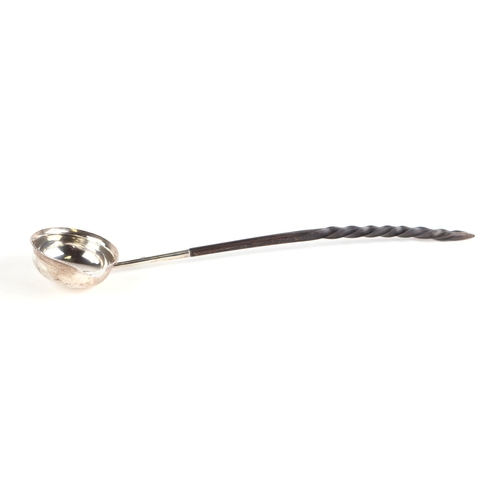 441 - A Georgian silver toddy ladle, initialled, marks rubbed, with whalebone handle, 32cms long.