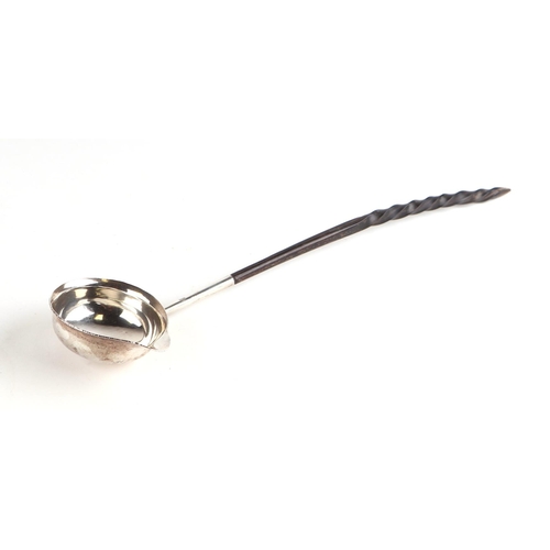 441 - A Georgian silver toddy ladle, initialled, marks rubbed, with whalebone handle, 32cms long.