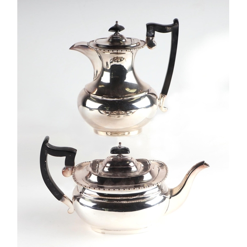 443 - A two-piece silver plated tea service.