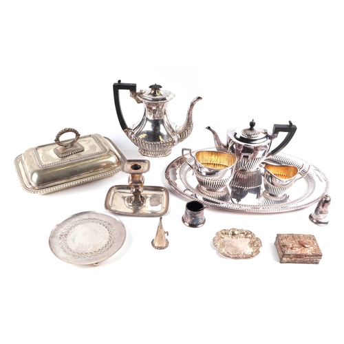 447 - A quantity of assorted silver plated items to include a chamberstick, entree dish and cover, tea ser... 