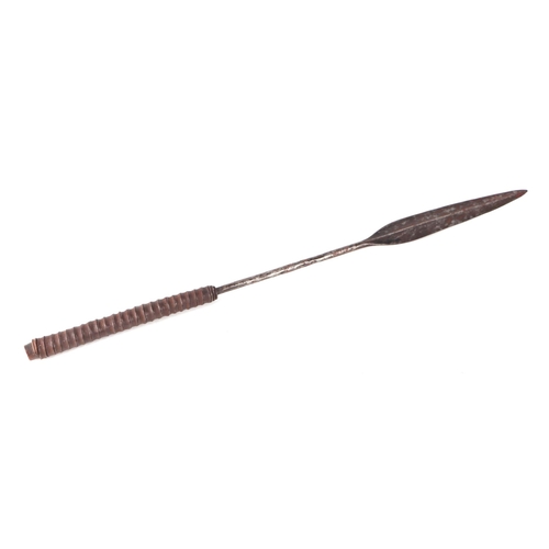 45 - An African Zulu type tribal leaf form steel stabbing spear head with remains of wooden shaft, 73cms ... 