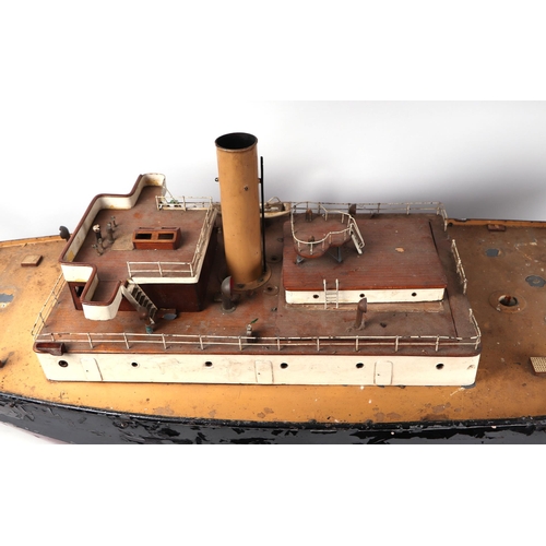 74 - Naval interest:  A large scratch built model, iron clad with brass fittings, originally steam powere... 