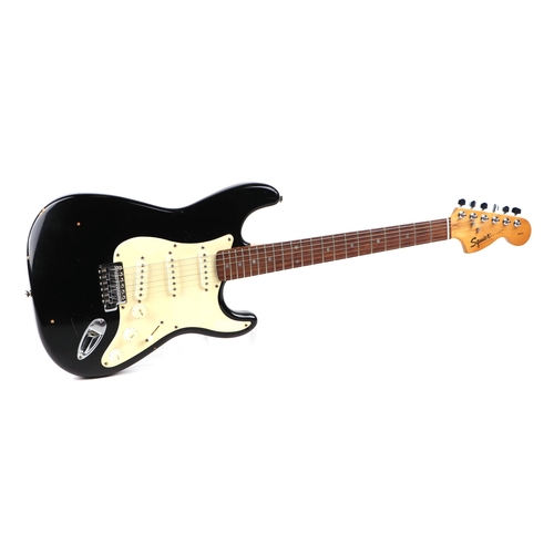 75 - A Squire Stratocaster by Fender Electric Guitar, in a soft carry case.