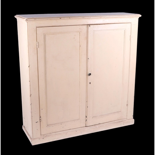 755 - A Victorian painted pine cabinet, the twin panelled doors enclosing a shelved interior, on a plinth ... 