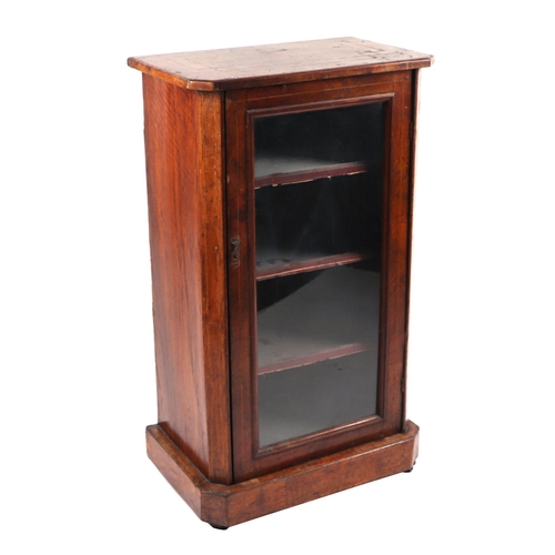 758 - A Victorian rosewood side cabinet, the single glazed panelled door enclosing a shelved interior, on ... 