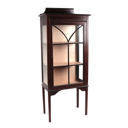 759 - An Edwardian mahogany display cabinet, the astragal glazed panelled door enclosing a shelved interio... 