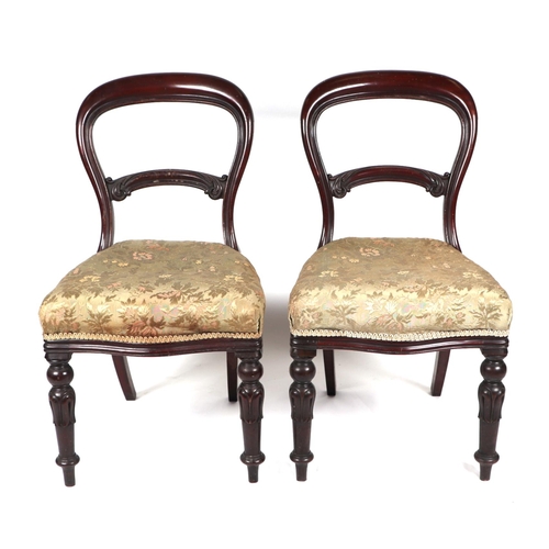 761 - A set of four Victorian mahogany balloon back dining chairs with overstuffed seats and reeded and tu... 