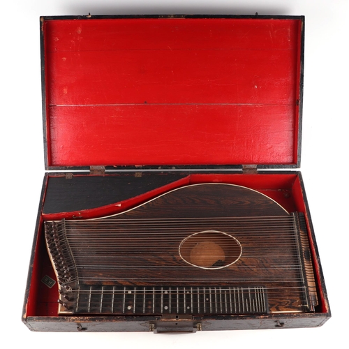 81 - A zither cased.