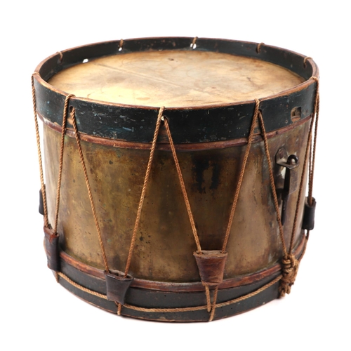 82 - A brass and wooden military marching drum, 40cms diameter.