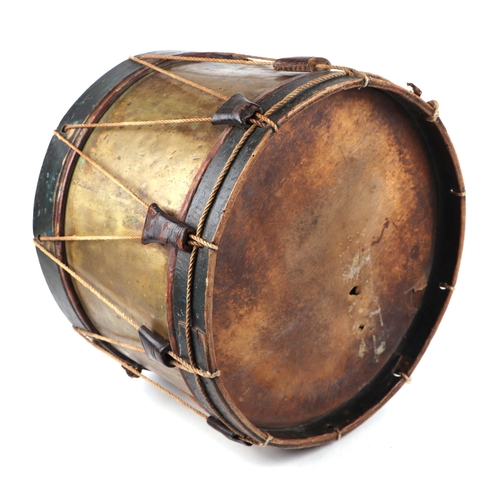 82 - A brass and wooden military marching drum, 40cms diameter.