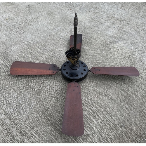 903 - An early 20th century vintage Westinghouse Sidewinder cast iron ceiling fan with two propeller type ... 