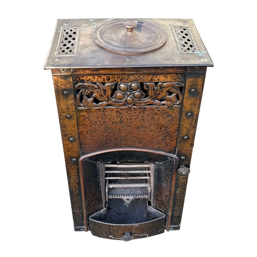 30 - A French Art Nouveau metal stove, 44cms wide.