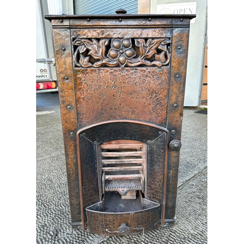 30 - A French Art Nouveau metal stove, 44cms wide.