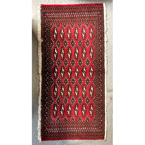 149 - Two small Persian Turkoman woollen hand-made rugs with geometric designs on a red ground, each appro... 