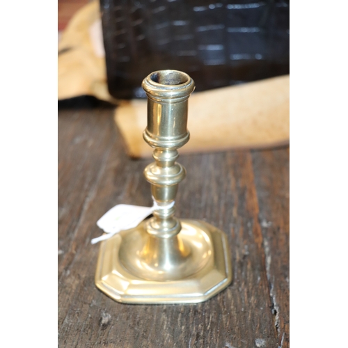 291 - An early brass candlestick, 14cms high.