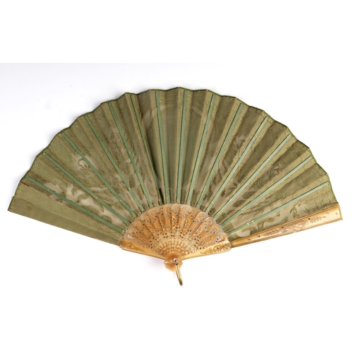 1030 - An 18th century pierced horn fan with gilt and inlaid decoration, the leaf with intricate sequin dec... 