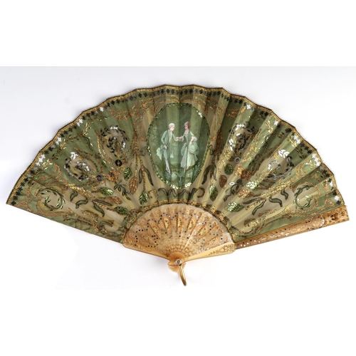 1030 - An 18th century pierced horn fan with gilt and inlaid decoration, the leaf with intricate sequin dec... 