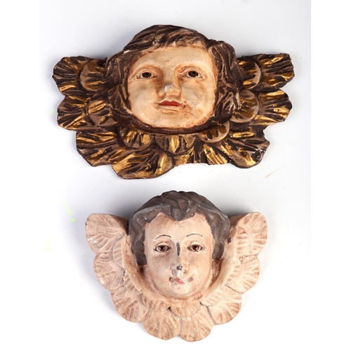 1047 - Two Baroque style carved and painted wooden cherubs with glass eyes, 22cm and 15cm wide (2)