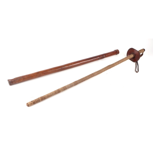 105 - An early 20th century Wandsworth Police mounted horse baton or truncheon in its leather sheath. The ... 