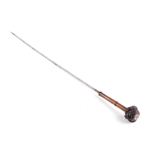 108 - A German pre 1947 bamboo sword stick, the pommel with a Nazi party enamel badge, 86cm long.