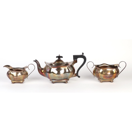 1137 - A three-piece silver tea set, Birmingham 1929, 982g.