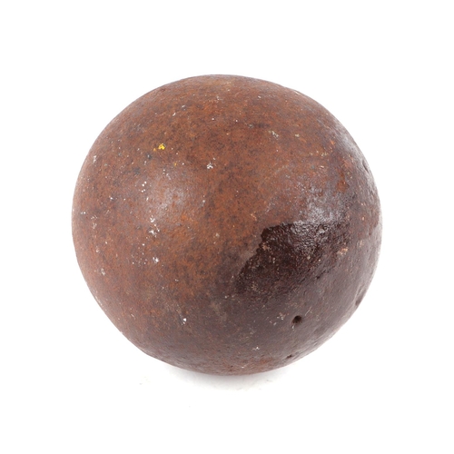 121 - A cast iron cannon ball, approx 10cms diameter.