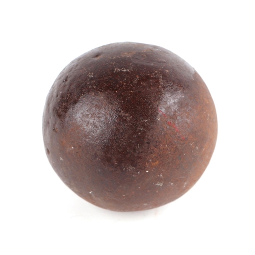 121 - A cast iron cannon ball, approx 10cms diameter.