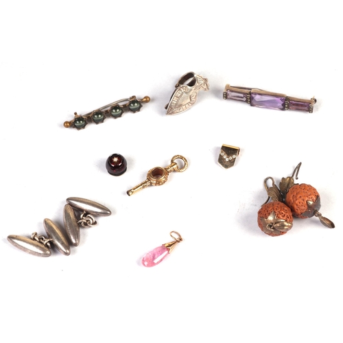 1219 - A small group jewellery including a yellow coloured metal mounted pink tourmaline pendant, a Victori... 