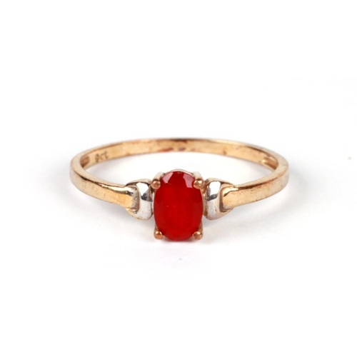 1223 - A 9ct gold dress ring set with an oval red stone (possibly synthetic ruby), approx UK size 'K', 0.9g... 