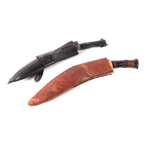 130 - A Kukri with leather scabbard, 42cms long; together with another similar (2).