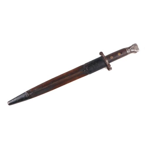 134 - A WWI bayonet with 30cms steel blade, signed 'Wilkinson London', with metal and leather scabbard.