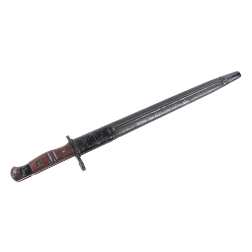 135 - A WWI K bayonet with 42cms long double fuller steel blade with metal and leather scabbard.