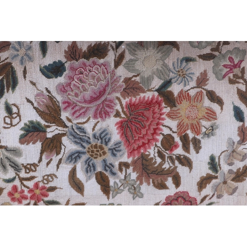 1367 - A needlework tapestry panel depicting flowers and foliage, 49 by 57cms, in a rosewood frame.